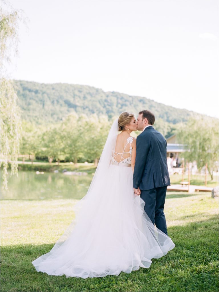 bride and groom kissing after ceremony